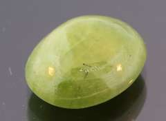 Mirror luster 9.44ct Sphene cabochon
