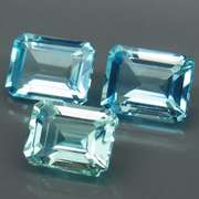 Eye clean 8.25ct vivid blue emerald cut Topaz set