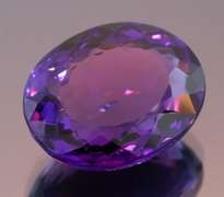 Oval cut 17.60ct royal purple created Amethyst