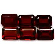 Heavy 11.89ct untreated emerald cut Garnet set