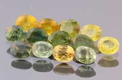 Glittering 6.69ct green and gold Sapphire set