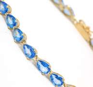 Gorgeous Pear Blue Topaz Line Yellow Gold Bracelet