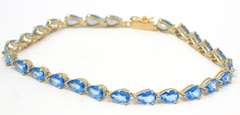 Gorgeous Pear Blue Topaz Line Yellow Gold Bracelet