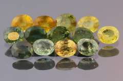 Glittering 6.69ct green and gold Sapphire set