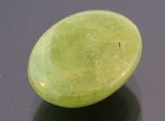 Mirror luster 9.44ct Sphene cabochon