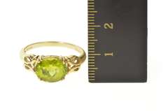 10K Yellow Gold Faceted Oval Peridot Scroll Filigree Ring