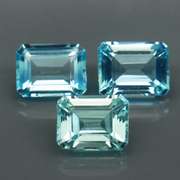 Eye clean 8.23ct vivid blue emerald cut Topaz set