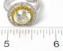 Striking 18KT 4.15CTW Yellow & White Diamond Ring
