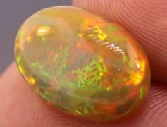 Magnificent 4.58ct full body flashing Semi Black Opal