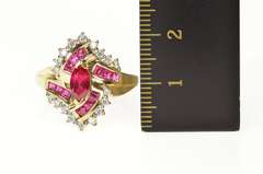 10K Yellow Gold Marquise Syn. Ruby Cubic Zirconia Halo Bypass Ring