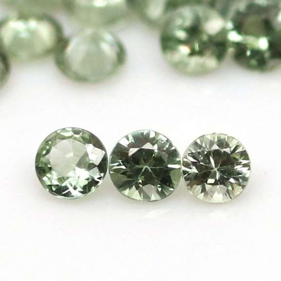 Fantastic 6.24ct diamond cut GREEN Sapphire set