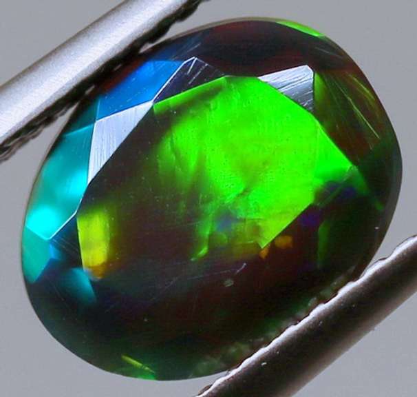 Fully faceted full panel flashing 1.45ct oval cut Black Opal