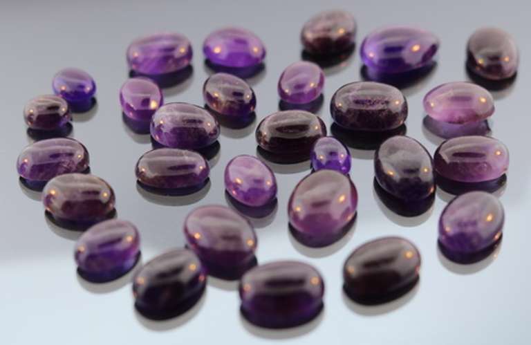 Heavy 259ct collection of deep violet Amethyst cabochons
