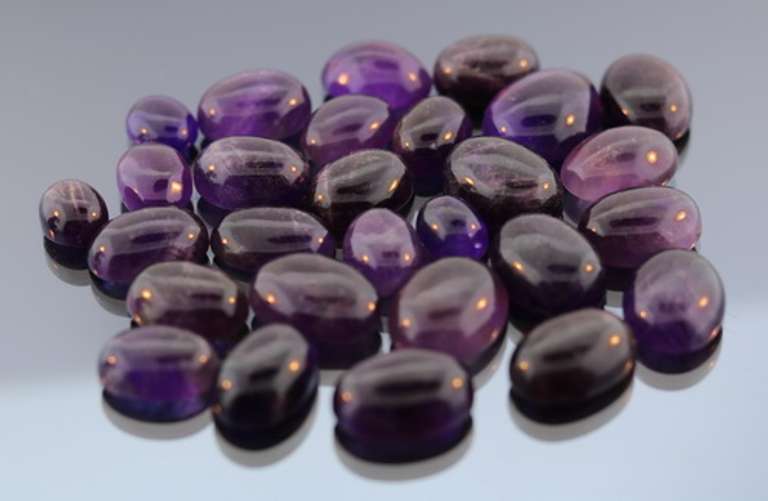Heavy 259ct collection of deep violet Amethyst cabochons