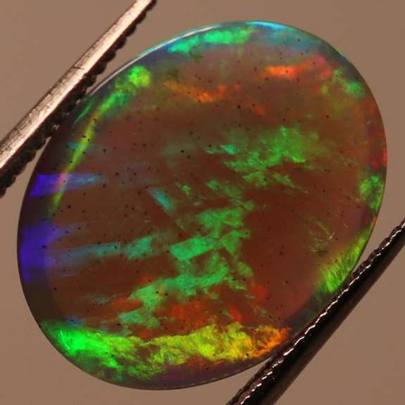 Glowing! 2.27ct full cover multi-pattern black Opal