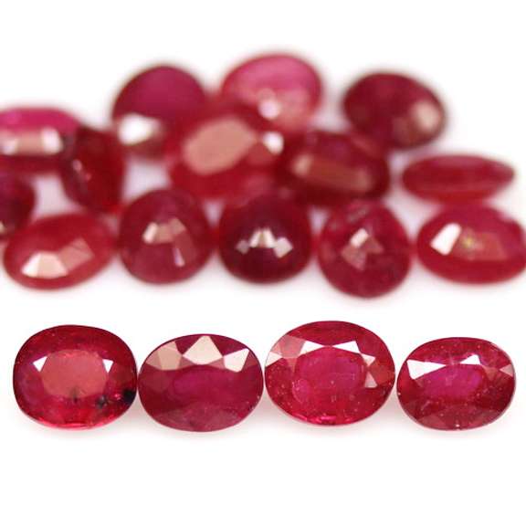 Vibrant 8.30ct oval cut imperial red Ruby set