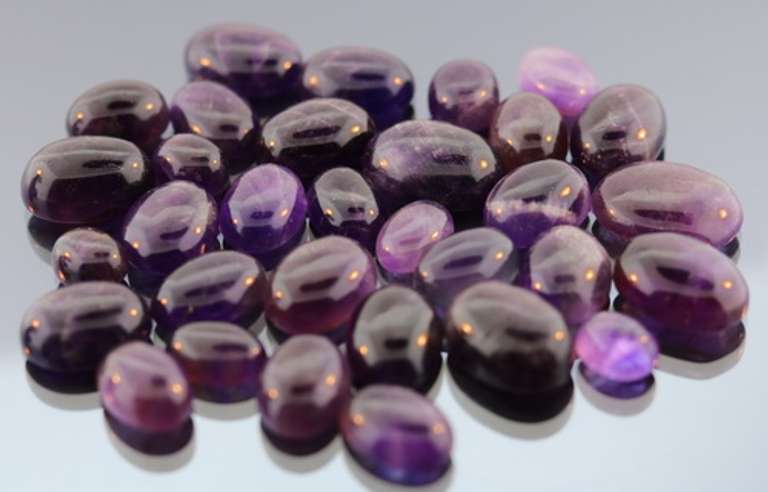 Heavy 285ct collection of deep violet Amethyst cabochons