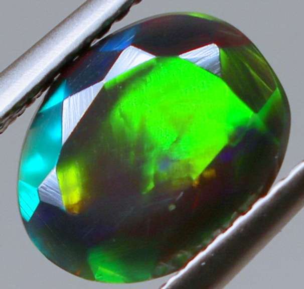 Fully faceted full panel flashing 1.45ct oval cut Black Opal
