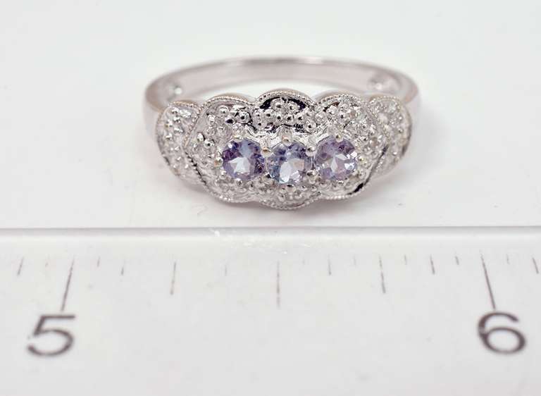 White Gold Ring Featuring Purple Gems with Diamond Accents