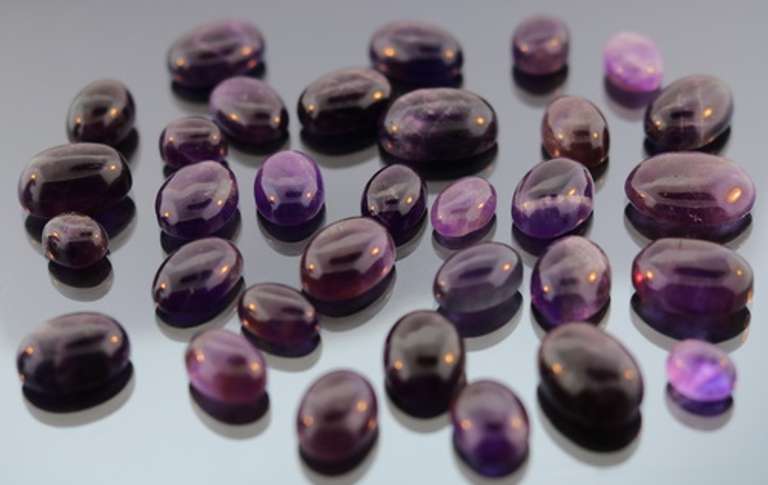 Heavy 285ct collection of deep violet Amethyst cabochons