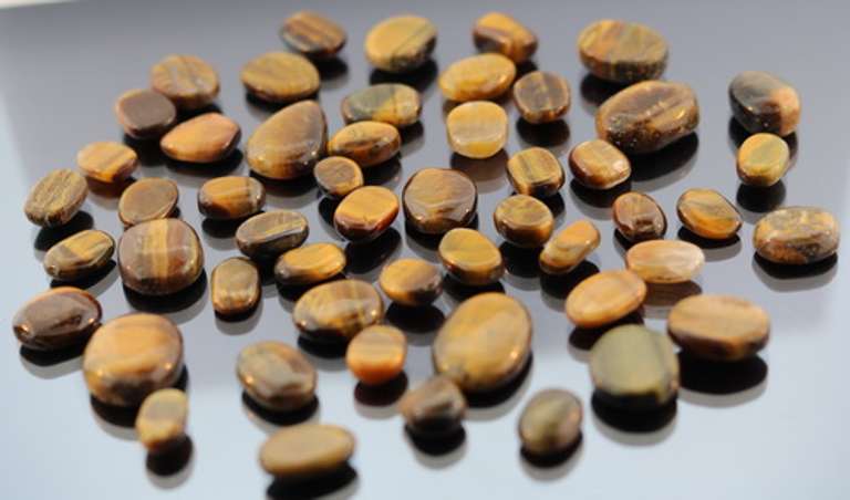 Huge 334.5ct parcel of natural Tigers Eye cabochons