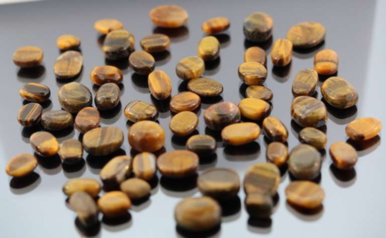 Huge 334.5ct parcel of natural Tigers Eye cabochons
