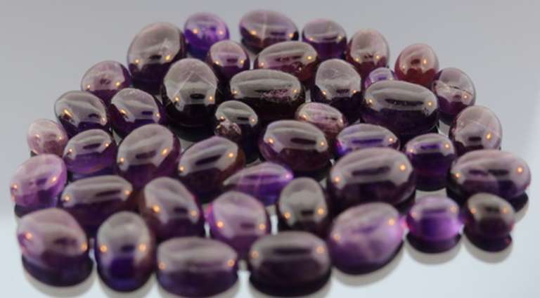 Huge! 293ct collection of deep violet Amethyst cabochons