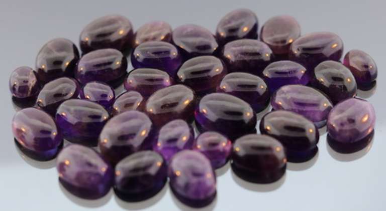 Heavy 270ct collection of deep violet Amethyst cabochons