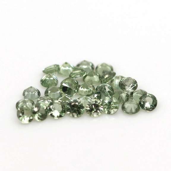 Fantastic 6.24ct diamond cut GREEN Sapphire set