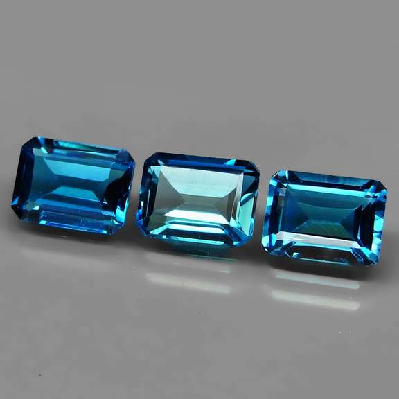 Superb 5.73ct vivid London blue emerald cut Topaz set