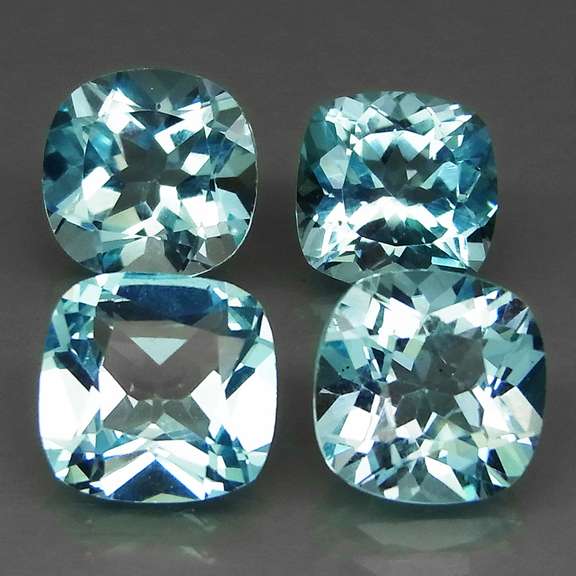 Large 17.85ct vivid blue cushion cut Topaz set