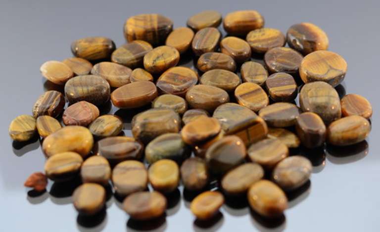 Huge 327ct parcel of natural Tigers Eye cabochons