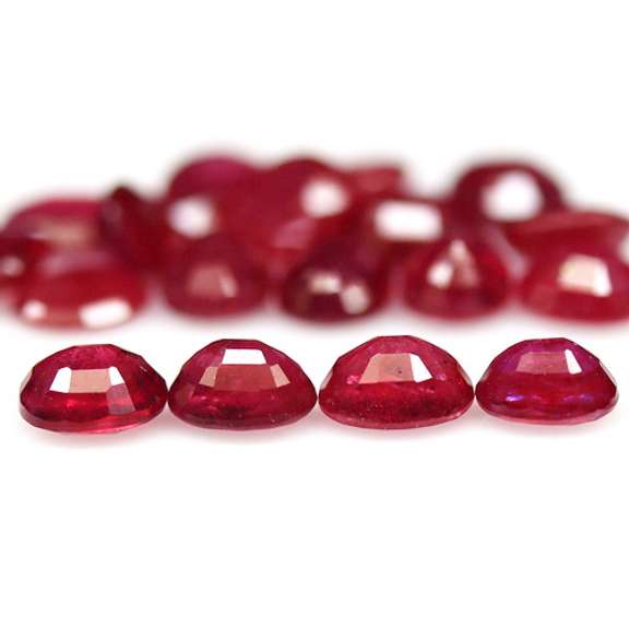 Vibrant 8.30ct oval cut imperial red Ruby set
