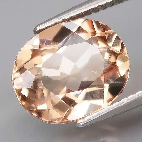 Striking 6.12ct 12x10mm champagne Topaz