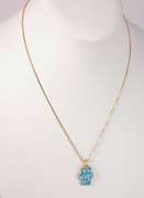 Seven Beautiful Blue Topaz Stones Set in a 14k Gold Pendant Looped with A 14k Gold Box Chain