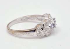White Gold Ring Featuring Purple Gems with Diamond Accents