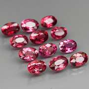 Amazing 8.22ct oval cut violet pink Garnet set