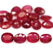 Vibrant 8.30ct oval cut imperial red Ruby set