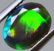 Fully faceted full panel flashing 1.45ct oval cut Black Opal