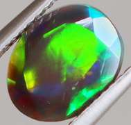 Fully faceted full panel flashing 1.45ct oval cut Black Opal