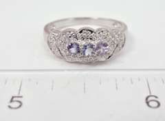 White Gold Ring Featuring Purple Gems with Diamond Accents