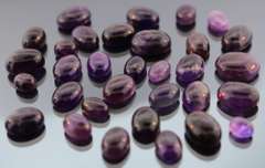 Heavy 285ct collection of deep violet Amethyst cabochons