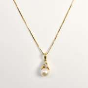 Feminine Pearl Pendant on Necklace