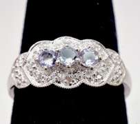 White Gold Ring Featuring Purple Gems with Diamond Accents