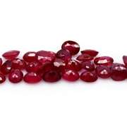 Vibrant 12.58ct oval cut reddish pink Ruby set