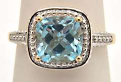 LADIES 10KT YELLOW GOLD BLUE TOPZ RING.