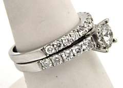 LADIES 14KT WHITE GOLD DIAMOND WEDDING BAND.