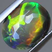 Fully faceted full panel flashing 1.45ct oval cut Black Opal