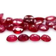 Vibrant 12.58ct oval cut reddish pink Ruby set