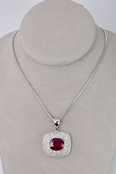 Ravishing 8.22CTS Ruby Set within A Sterling Silver Pendant with a 3.23CTW White Sapphire Gallery